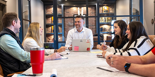 A group of people gathered around a table